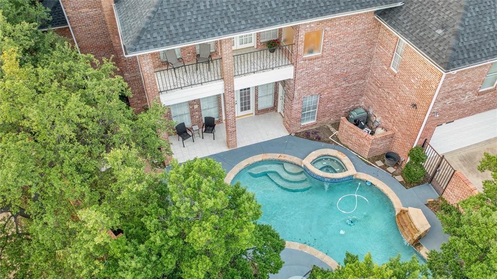 7204 Debbe Drive Dallas, TX 75252 - Photo 37 of 39 an aerial view of a house with garden space and parking