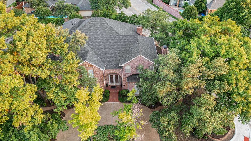 7204 Debbe Drive Dallas, TX 75252 - Photo 4 of 39 an aerial view of a house with swimming pool and garden