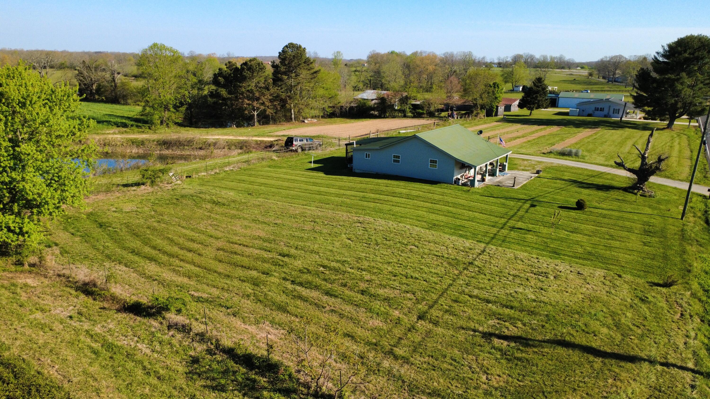 1107 Summer City Road Pikeville, TN 37367 - Photo 2 of 29 dji_fly_20260411_093402_67_1775914454265