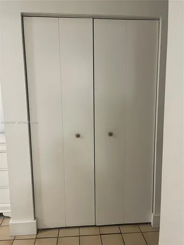 an empty room with white walls