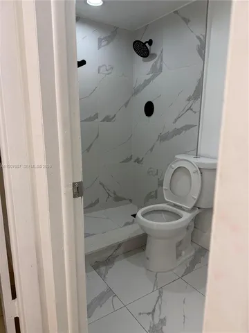 a view of a room with shelf on the wall