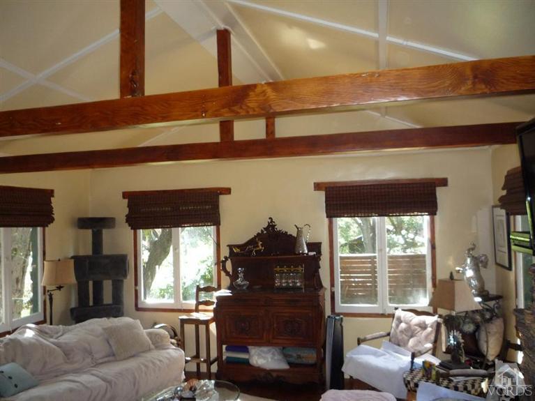 588 Cold Canyon Road Calabasas, CA 91302 - Photo 6 of 7 a living room with furniture and a floor to ceiling window