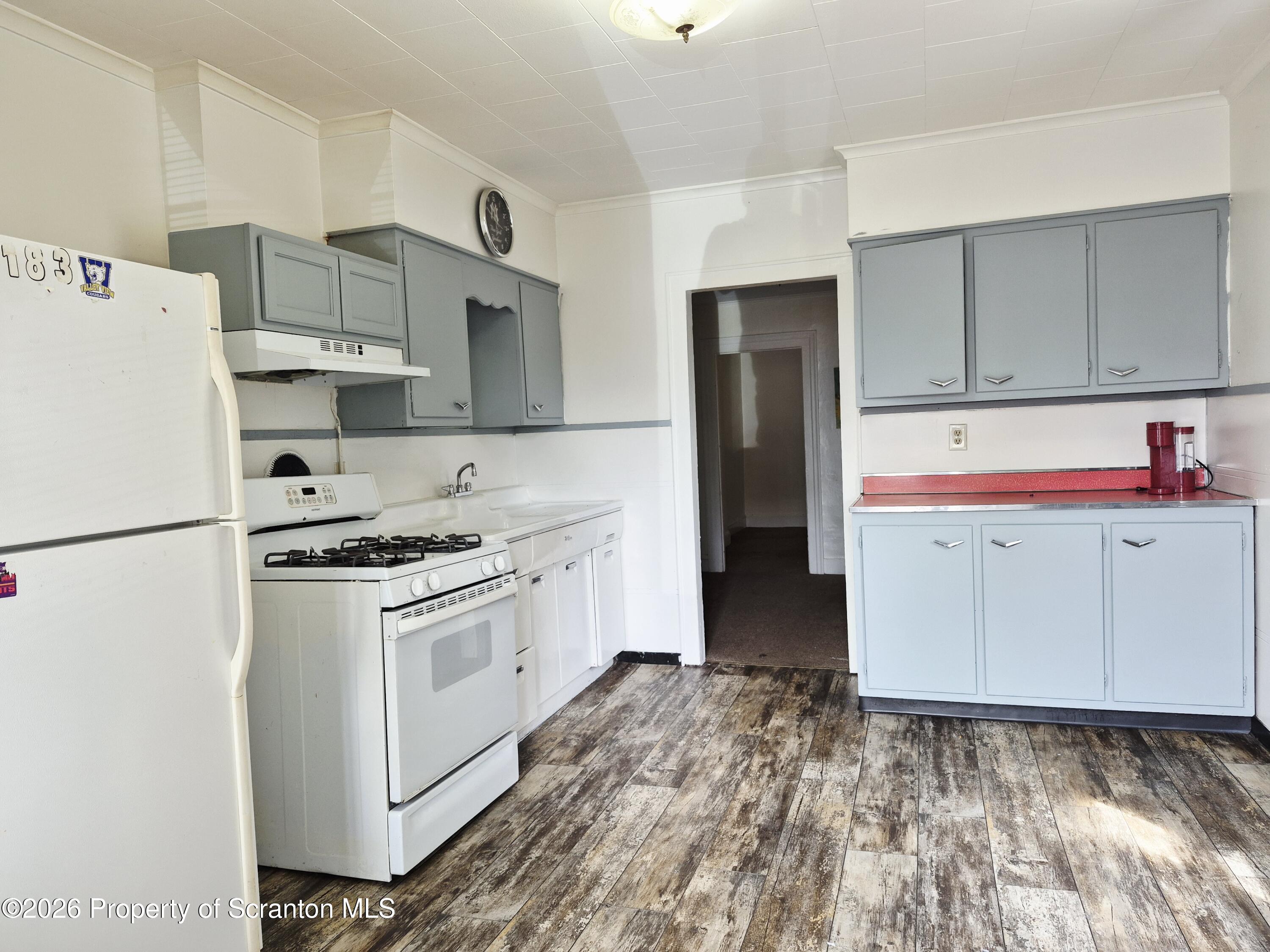 68 Green Place, Unit 1 Scranton, PA 18509 - Photo 2 of 15 a kitchen with stainless steel appliances a refrigerator sink and cabinets