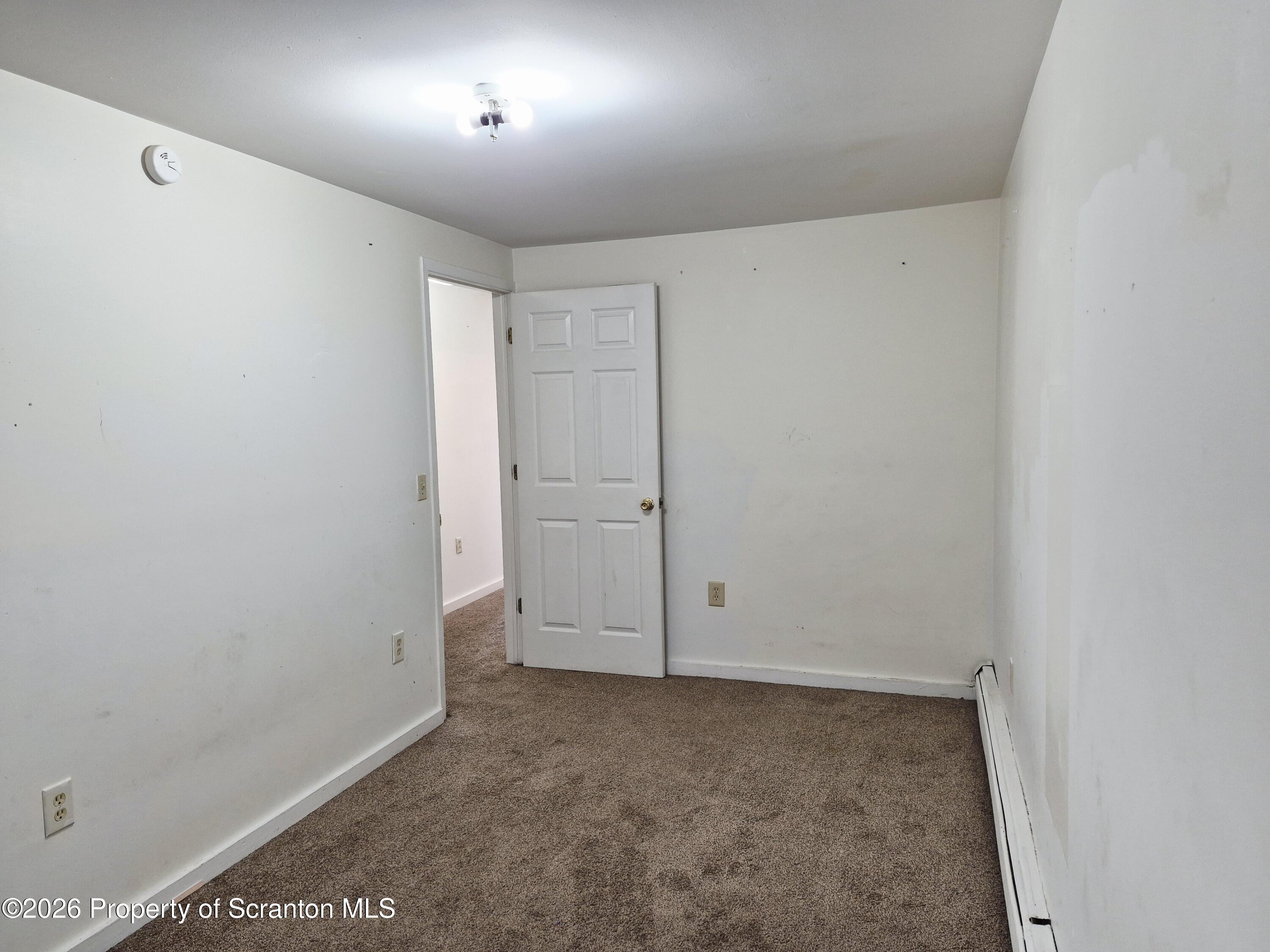 68 Green Place, Unit 1 Scranton, PA 18509 - Photo 9 of 15 an empty room with an entryway