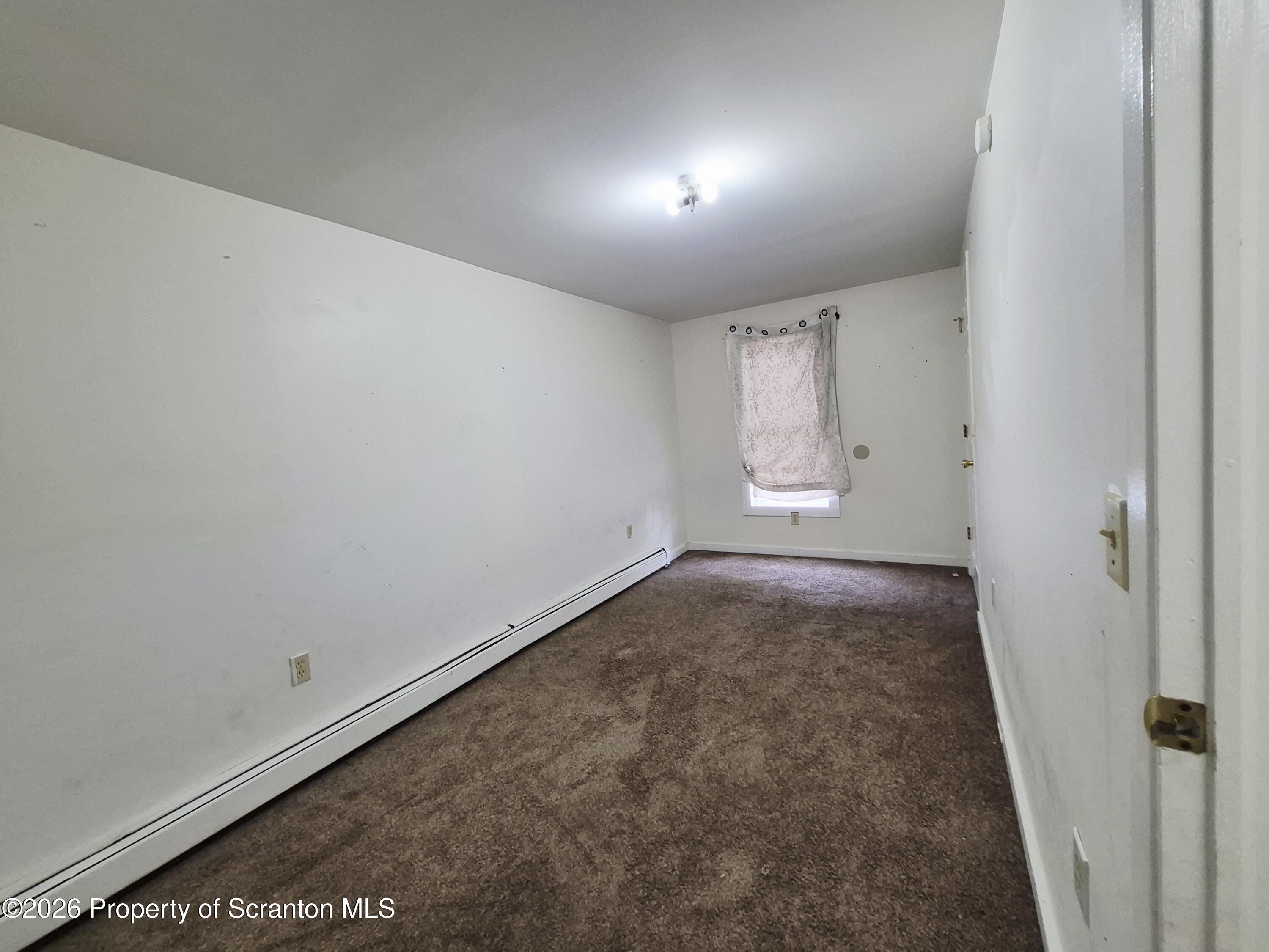 68 Green Place, Unit 1 Scranton, PA 18509 - Photo 10 of 15 an empty room with windows