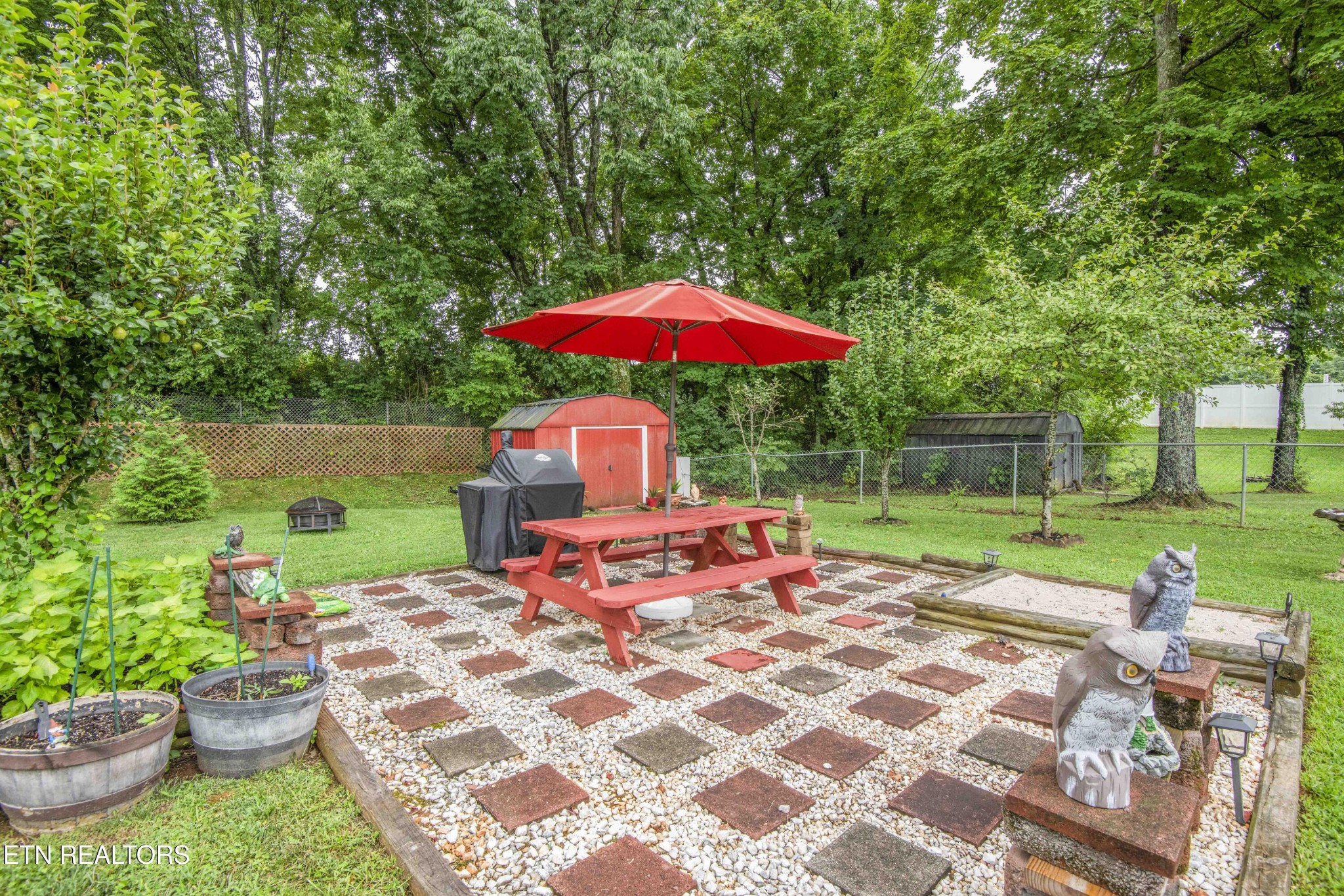 2206 Rambling Road Knoxville, TN 37912 - Photo 18 of 47 a view of a table and chairs under an umbrella