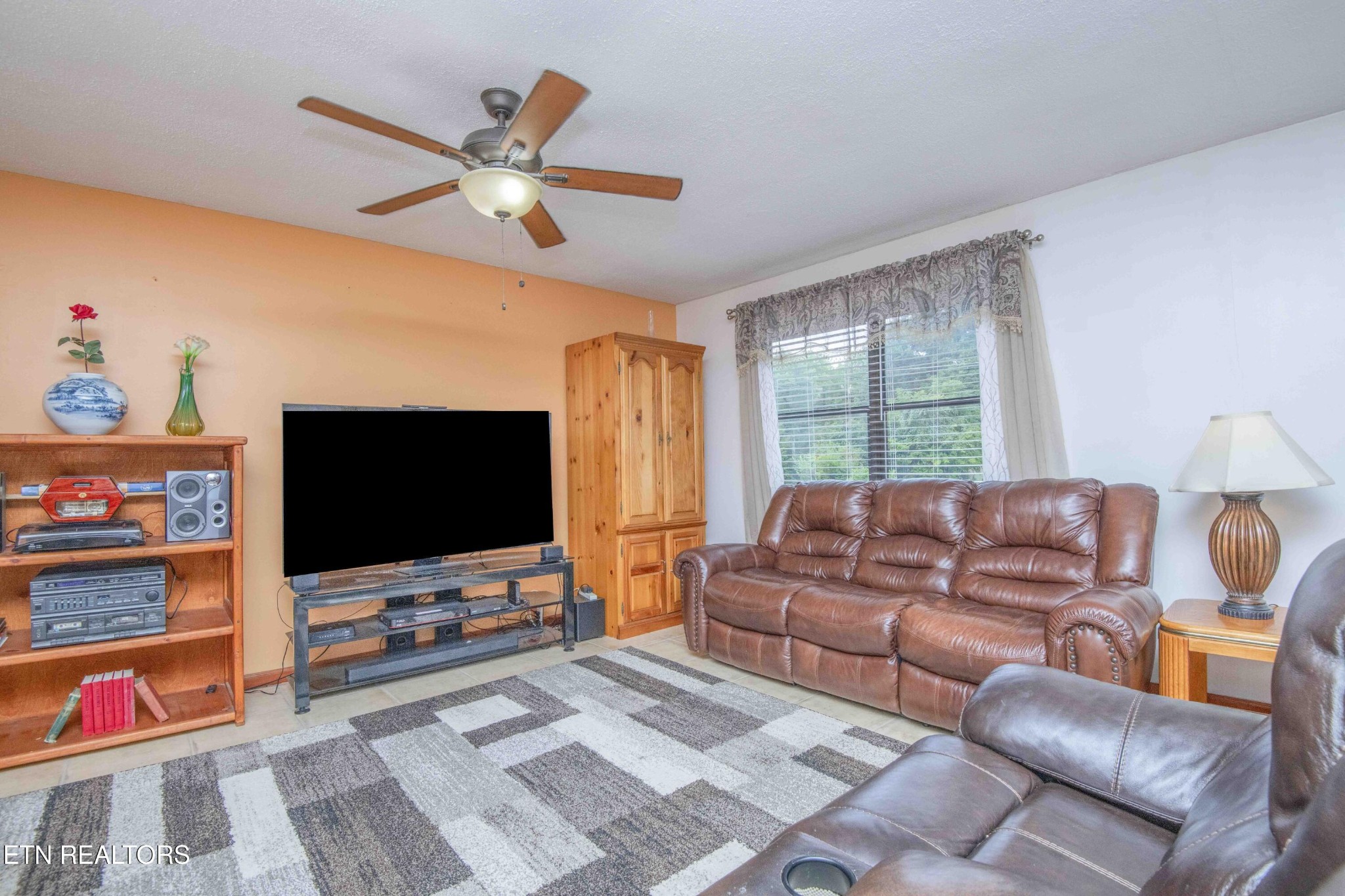 2206 Rambling Road Knoxville, TN 37912 - Photo 35 of 47 a living room with furniture and a flat screen tv