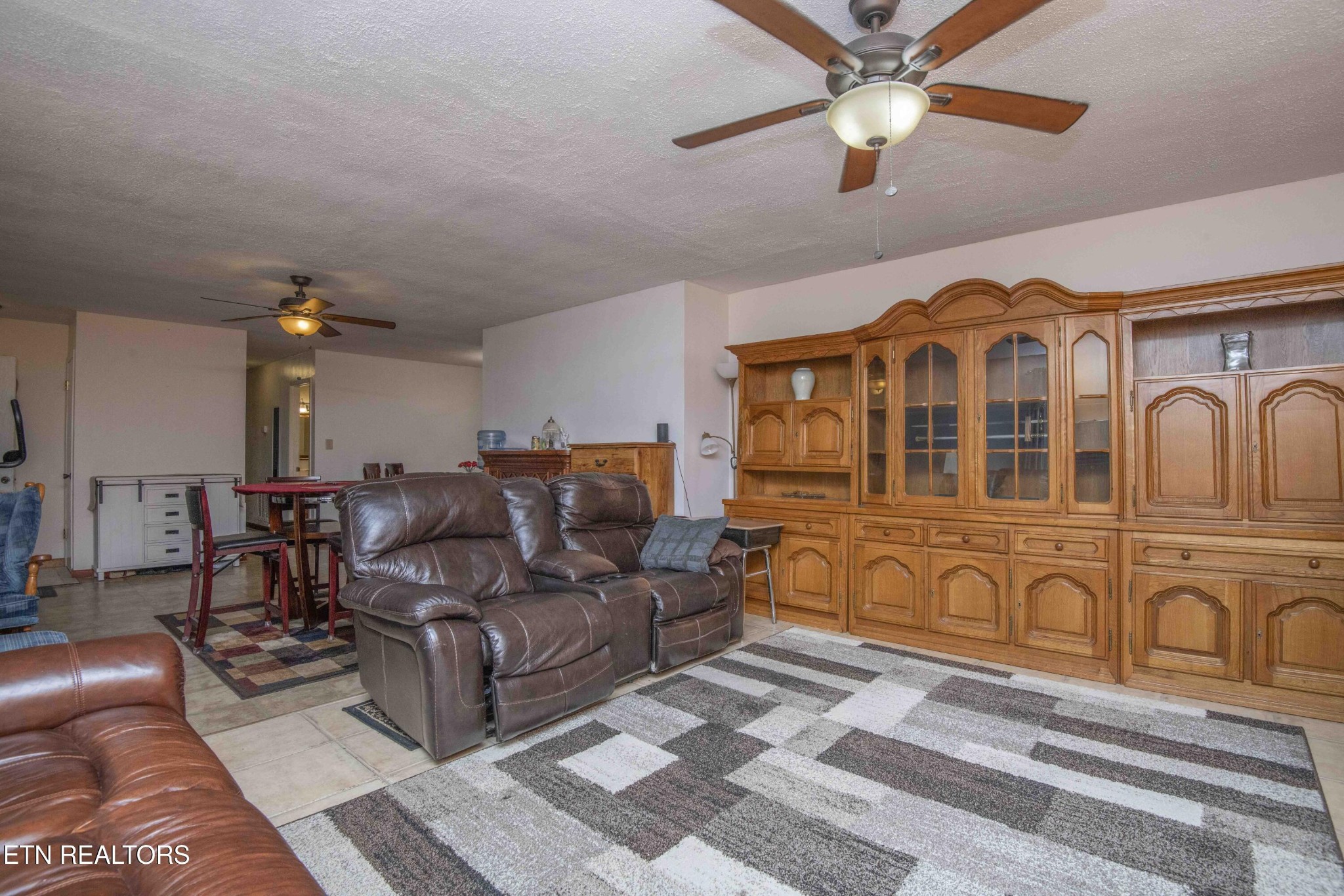 2206 Rambling Road Knoxville, TN 37912 - Photo 36 of 47 a living room with furniture ceiling fan and a rug