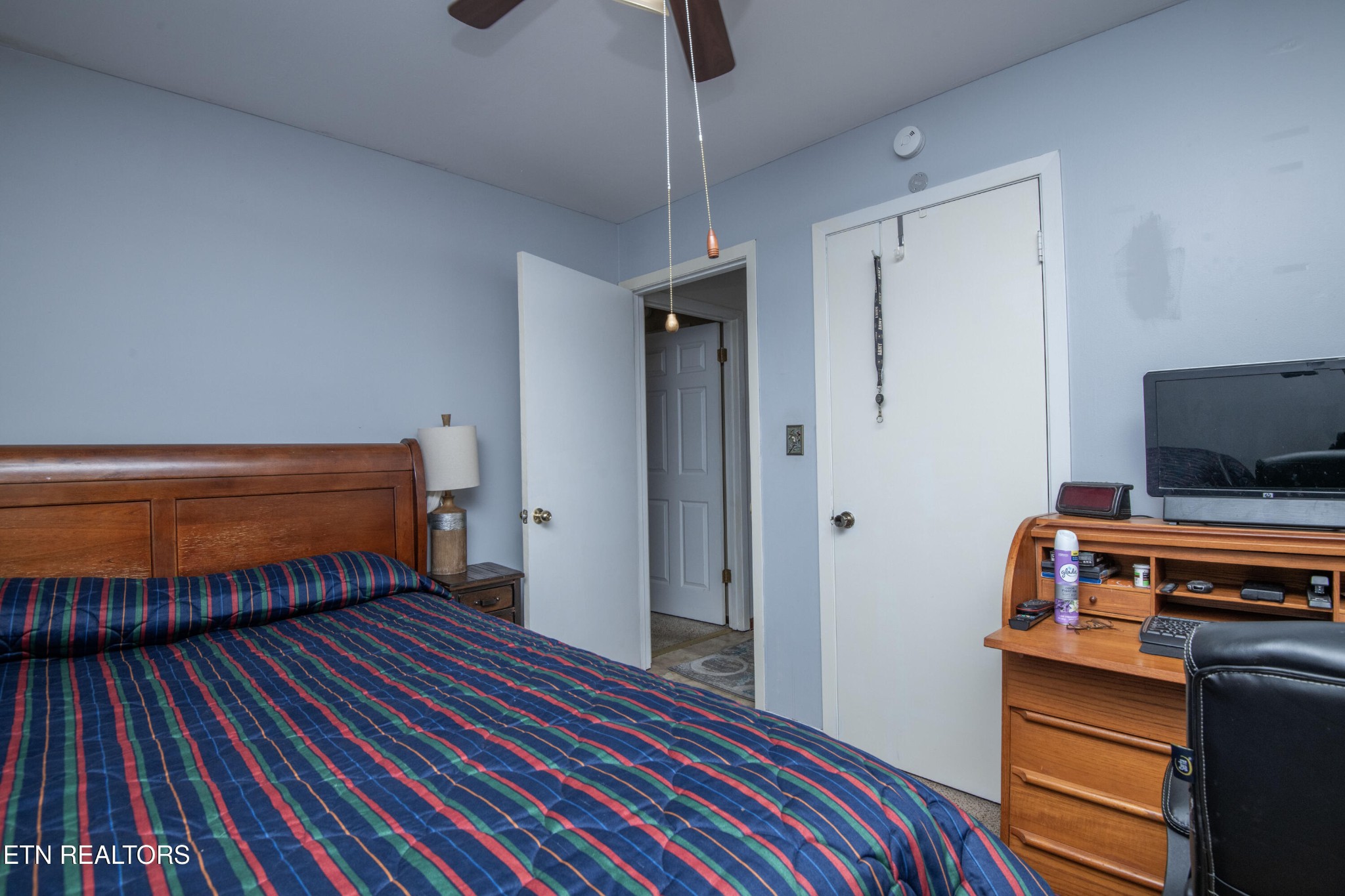 2206 Rambling Road Knoxville, TN 37912 - Photo 38 of 47 a bedroom with bed and a chandelier