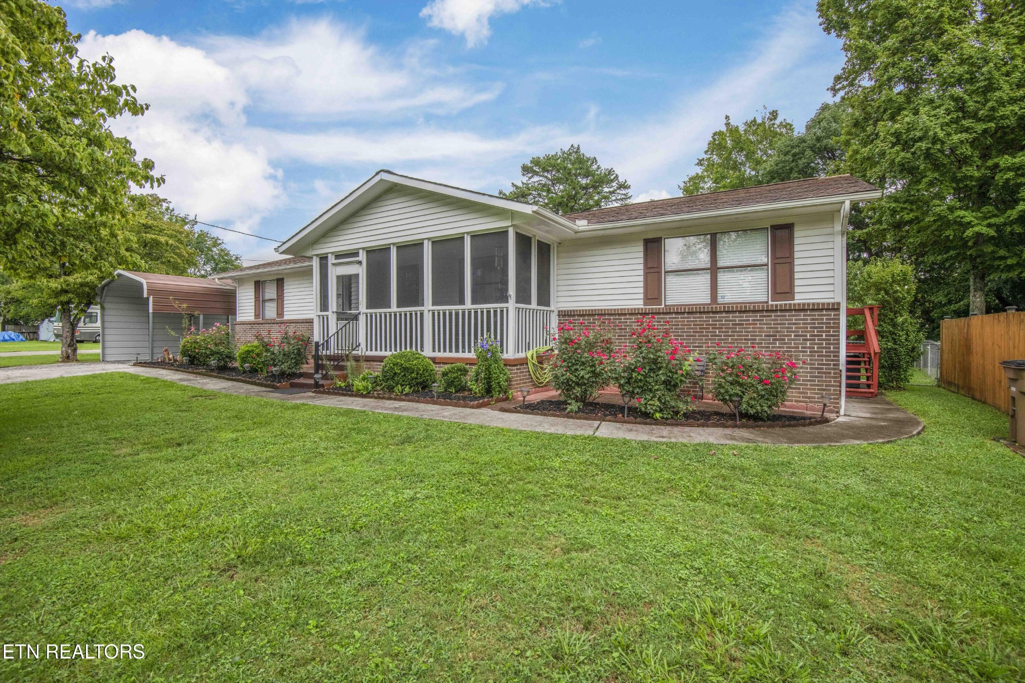 2206 Rambling Road Knoxville, TN 37912 - Photo 42 of 47 a front view of a house with a yard and potted plants