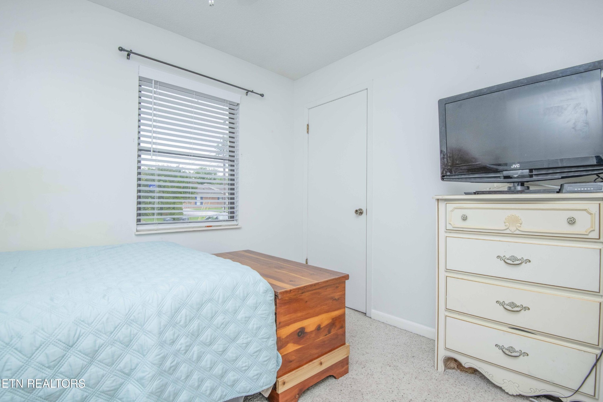 2206 Rambling Road Knoxville, TN 37912 - Photo 8 of 47 a bedroom with a bed and a flat screen tv