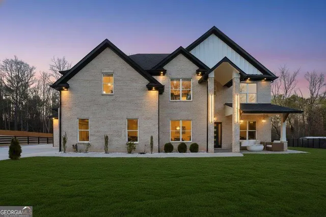 a front view of a house with a yard