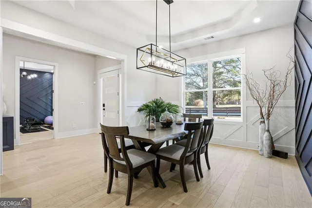 a view of a dining room with furniture window and wooden floor