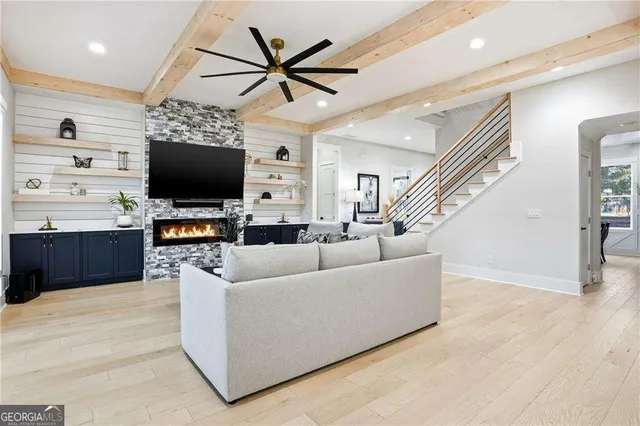 a living room with furniture and a flat screen tv