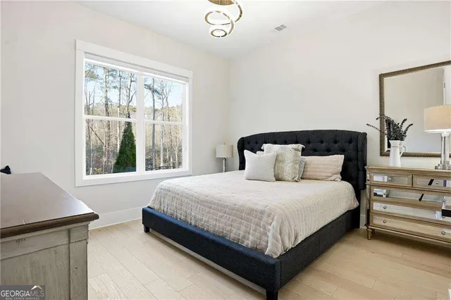 a bedroom with a bed and window