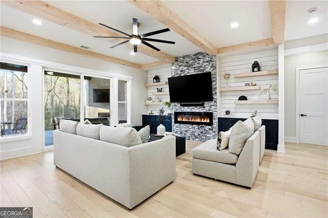 a living room with furniture and a flat screen tv