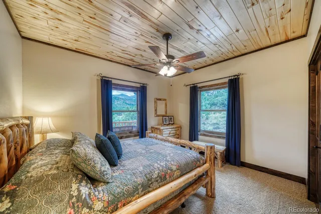 a bedroom with a large bed and a large window