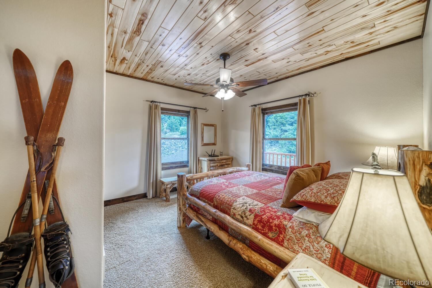 8966 Hanging Tree Drive Salida, CO 81201 - Photo 23 of 50 a bed sitting in a spacious bedroom next to a window