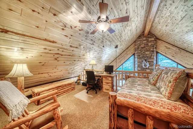 a bedroom with furniture and a chandelier