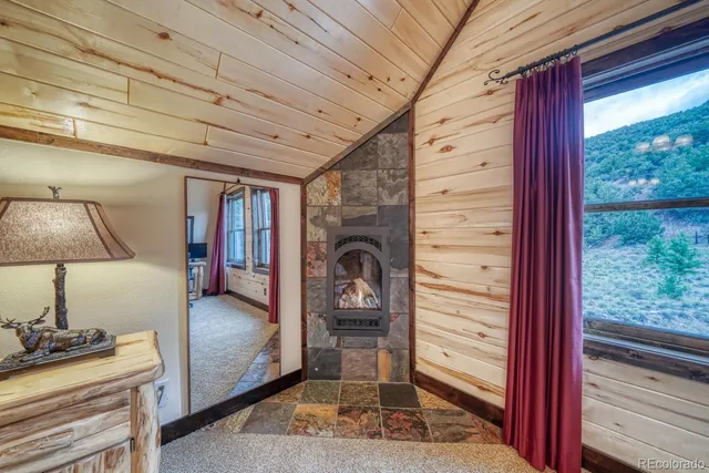 a bedroom with furniture and natural light