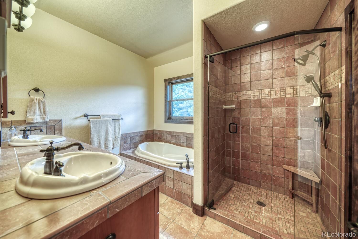 8966 Hanging Tree Drive Salida, CO 81201 - Photo 30 of 50 a bathroom with a sink and a mirror