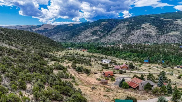 an aerial view of a house with swimming pool