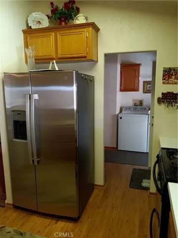 a kitchen with a refrigerator and a stove