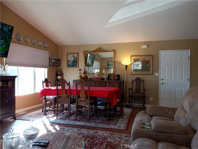 a living room with furniture and kitchen view