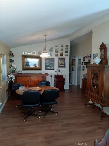 a room with furniture a flat screen tv and a fireplace