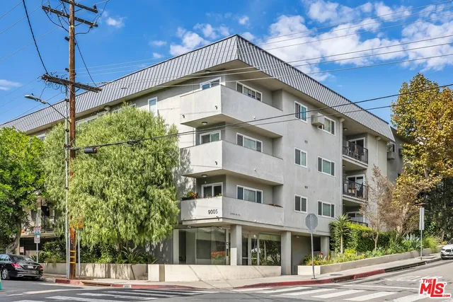 a tall building sitting on the side of a street