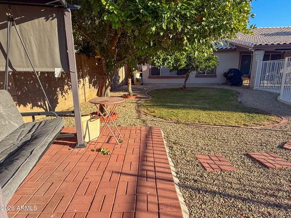swimming pool view with a seating space