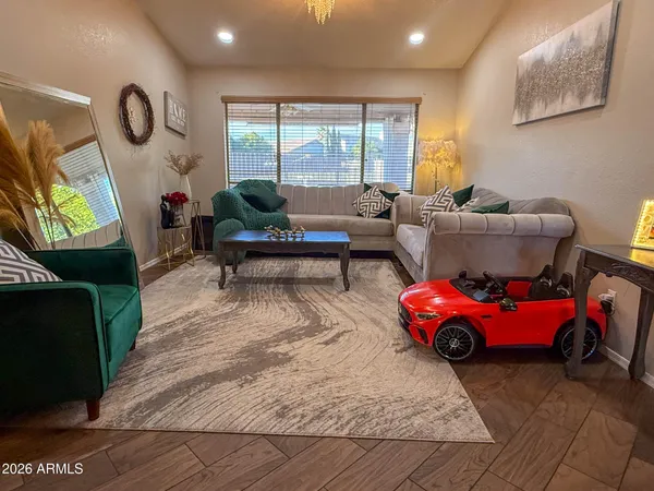 a living room with furniture and a large window