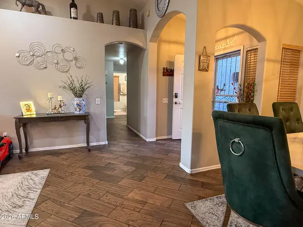 a view of livingroom with furniture and a mirror