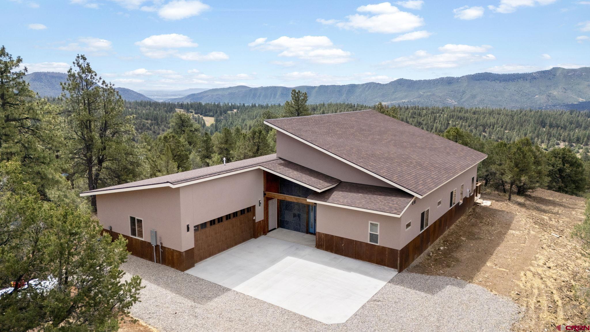 640 Sawmill Road Durango, CO 81303 - Photo 3 of 42 a view of a house with a terrace