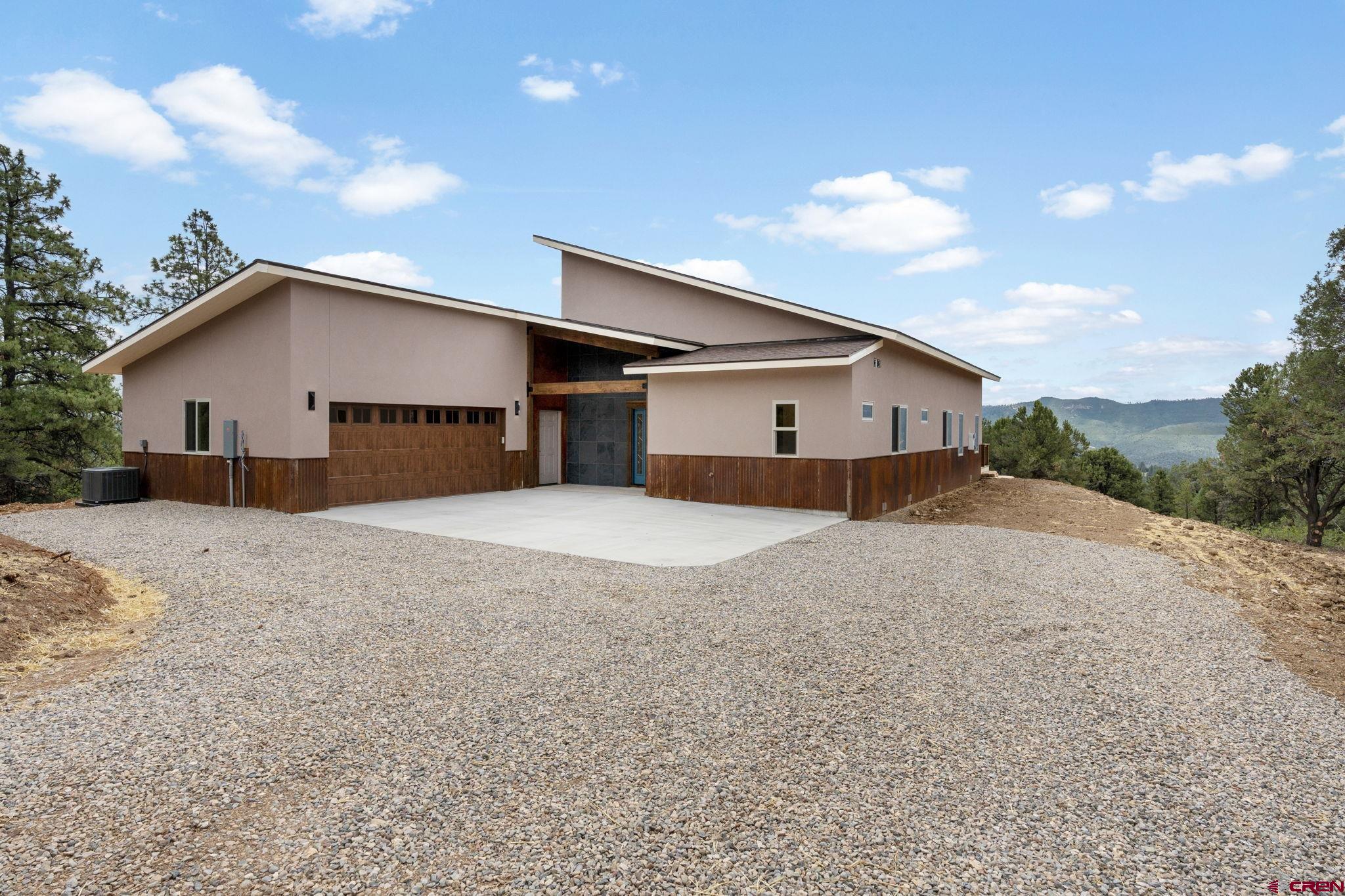 640 Sawmill Road Durango, CO 81303 - Photo 34 of 42 a view of a house with a backyard
