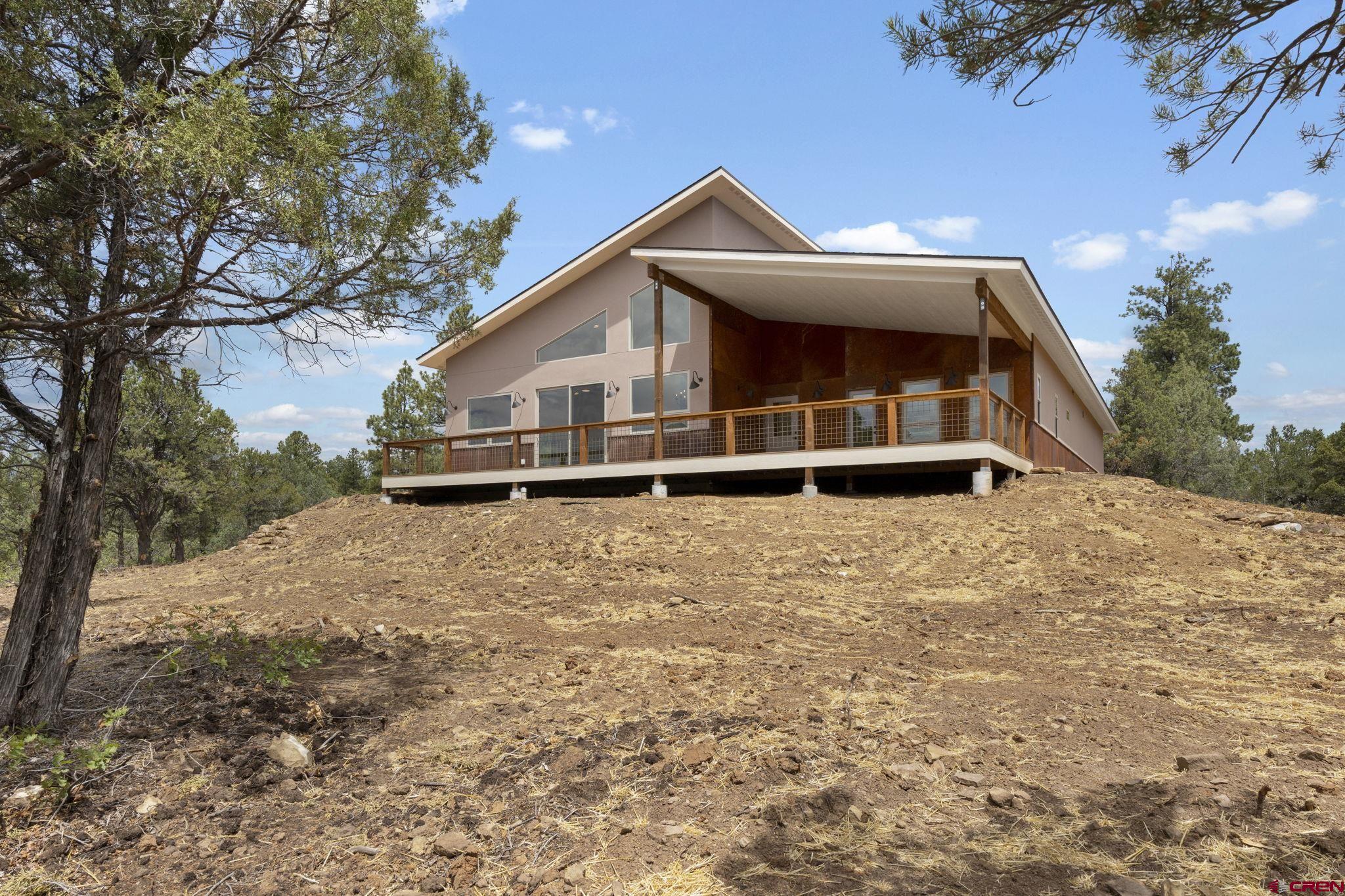 640 Sawmill Road Durango, CO 81303 - Photo 40 of 42 a front view of a house with a yard