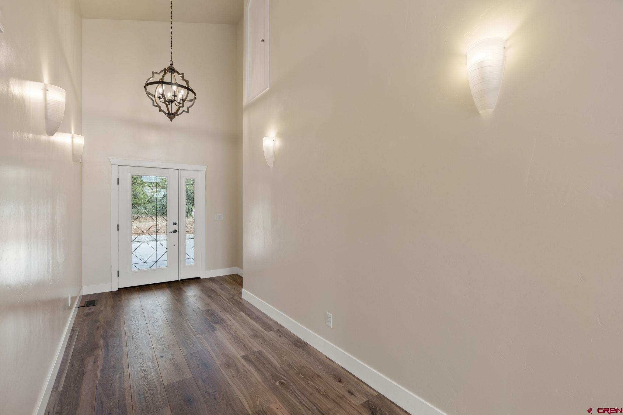 640 Sawmill Road Durango, CO 81303 - Photo 7 of 42 a view of a room with wooden floor fan and window