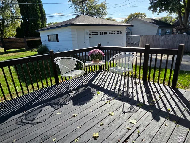 a view of a wooden deck with furniture