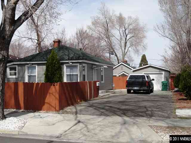 727 Roberts Street Reno, NV 89502 - Photo 1 of 11 a front view of a house with a yard covered in snow