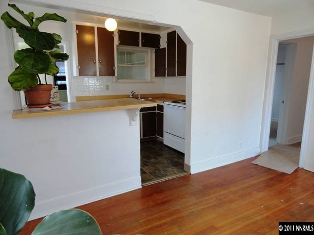 727 Roberts Street Reno, NV 89502 - Photo 8 of 11 a view of kitchen with sink and wooden floor