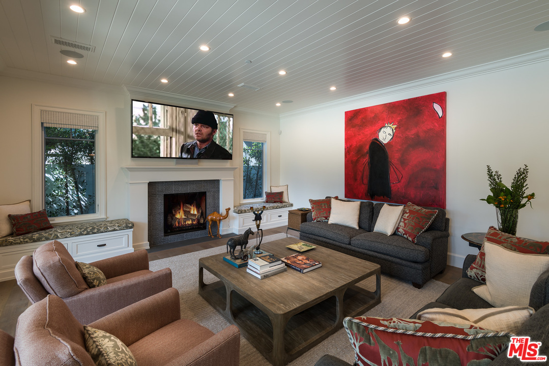 222 20th Street Santa Monica, CA 90402 - Photo 13 of 44 a living room with furniture fireplace and potted plant