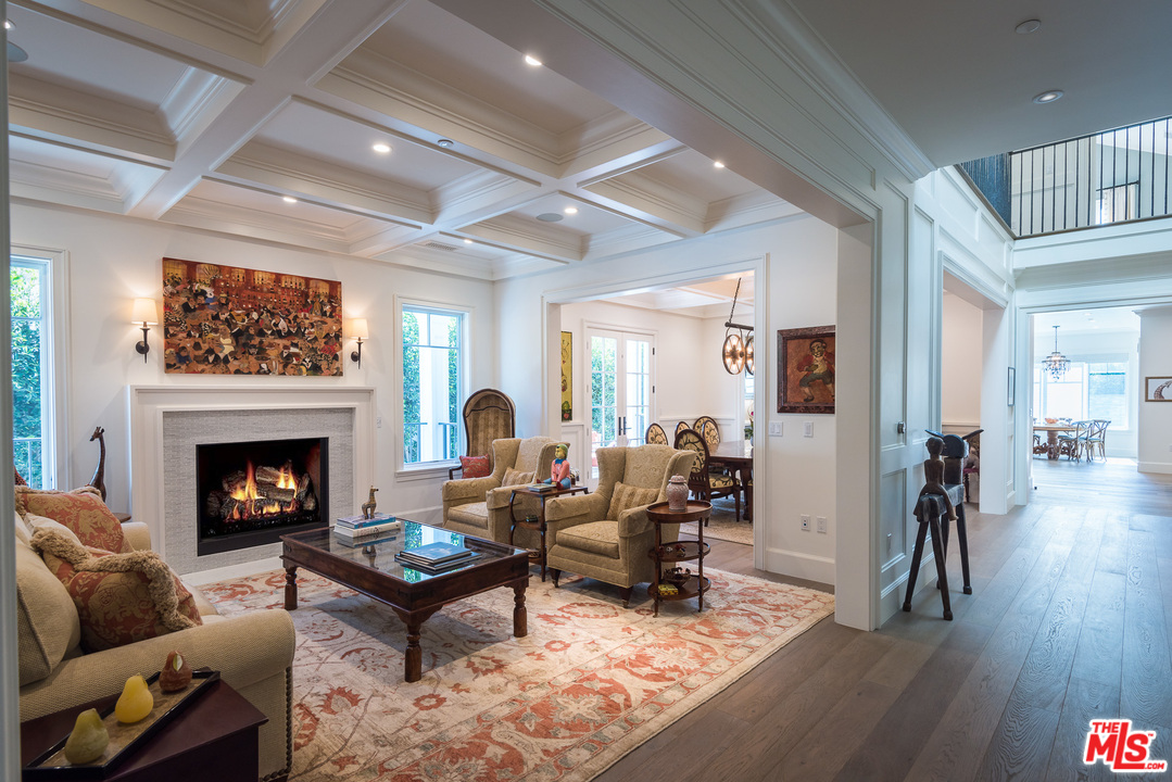 222 20th Street Santa Monica, CA 90402 - Photo 3 of 44 a living room with furniture a fireplace and wooden floor