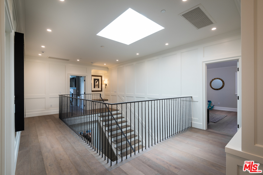 222 20th Street Santa Monica, CA 90402 - Photo 25 of 44 a view of a hallway with dining room and stairs