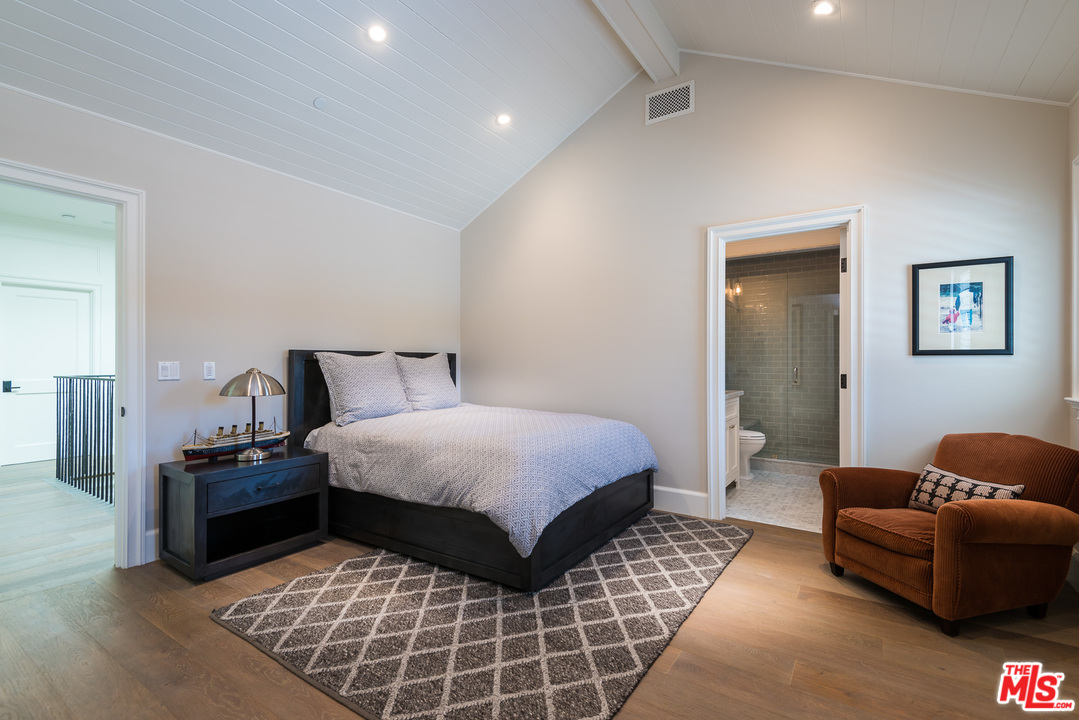 222 20th Street Santa Monica, CA 90402 - Photo 33 of 44 a bedroom with a bed and couch