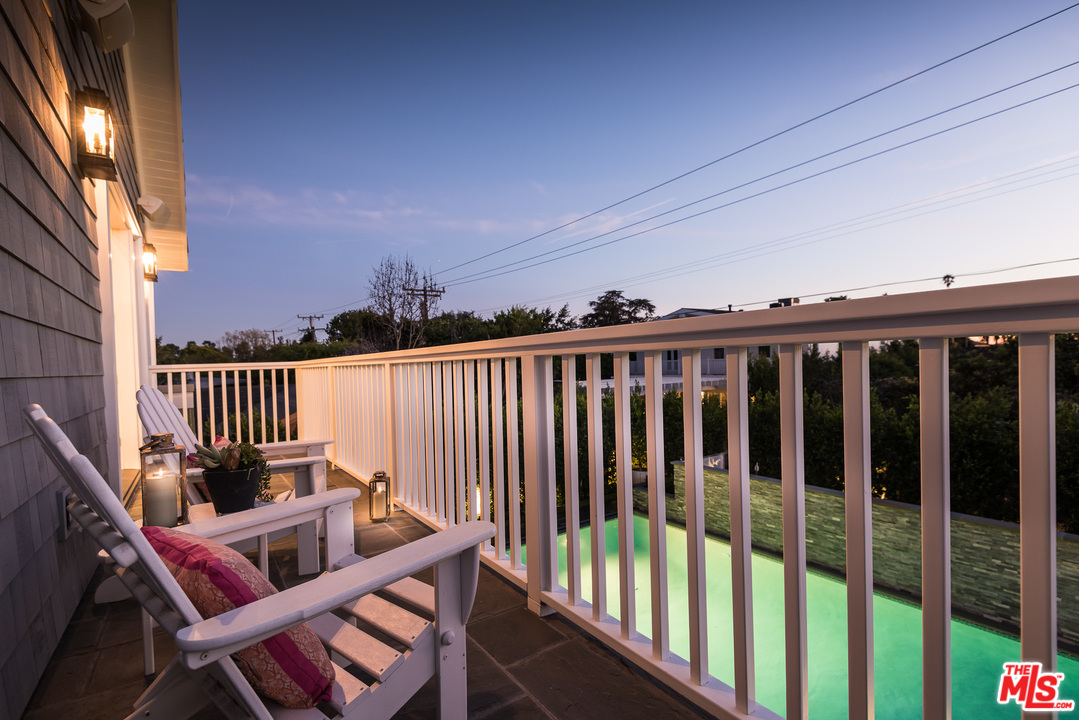222 20th Street Santa Monica, CA 90402 - Photo 40 of 44 a view of a chair in wooden deck