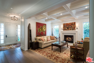 222 20th Street Santa Monica, CA 90402 - Photo 4 of 44 a living room with furniture a fireplace and a table