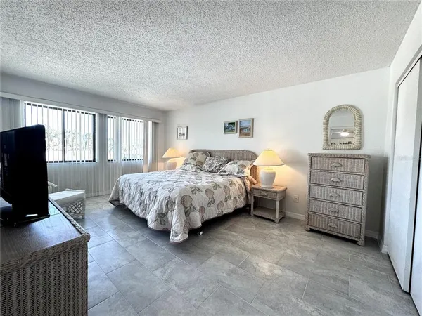 a bedroom with two beds and a window