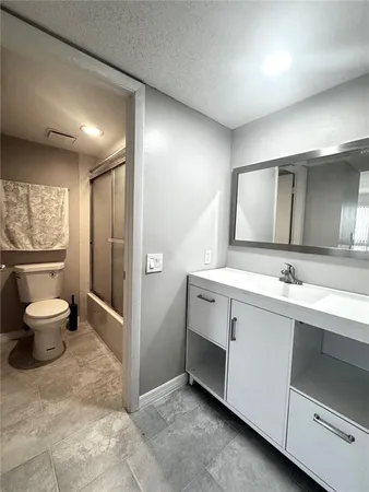 a bedroom with two beds and a couch