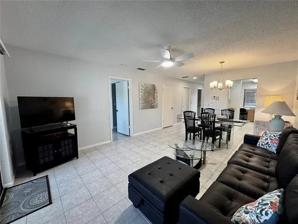 a bedroom with two beds and a couch