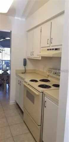 a bedroom with bed and a window